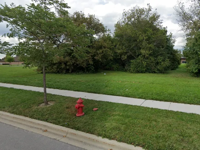 a view of a park with a slide