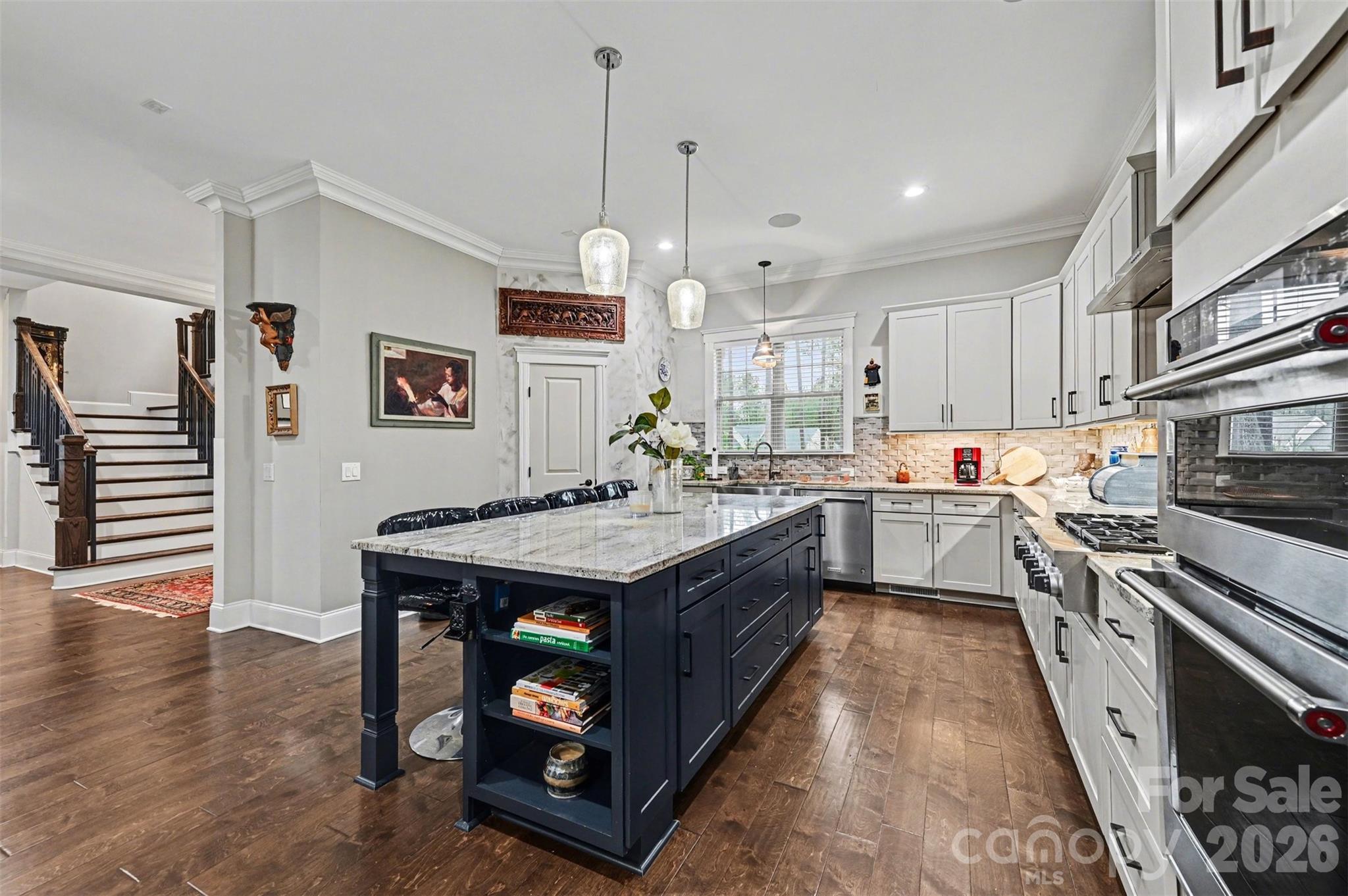6302 Chimney Bluff Road Lancaster, SC 29720 - Photo 11 of 47 a kitchen with a sink stove and wooden floor