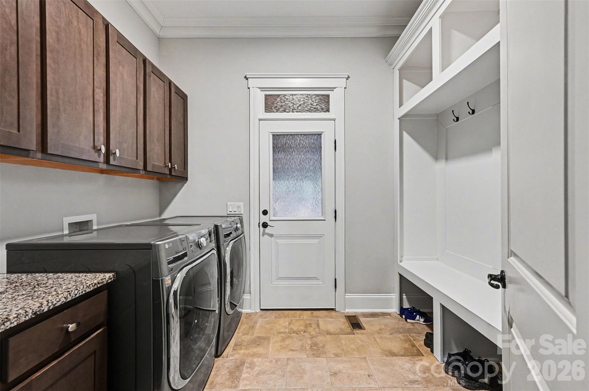 6302 Chimney Bluff Road Lancaster, SC 29720 - Photo 17 of 47 a utility room with cabinets washer and dryer