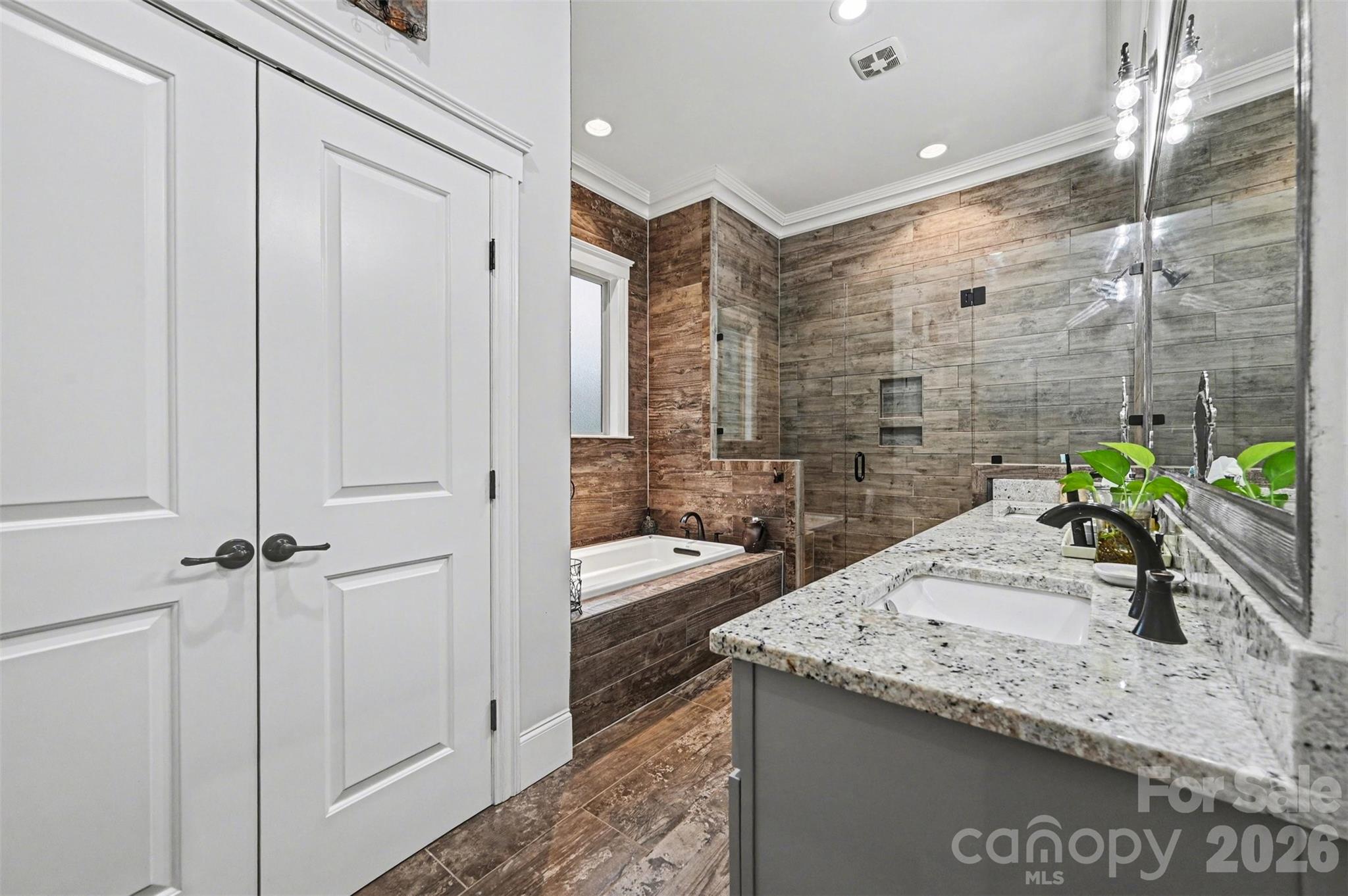 6302 Chimney Bluff Road Lancaster, SC 29720 - Photo 21 of 47 a bathroom with a granite countertop sink a toilet and shower
