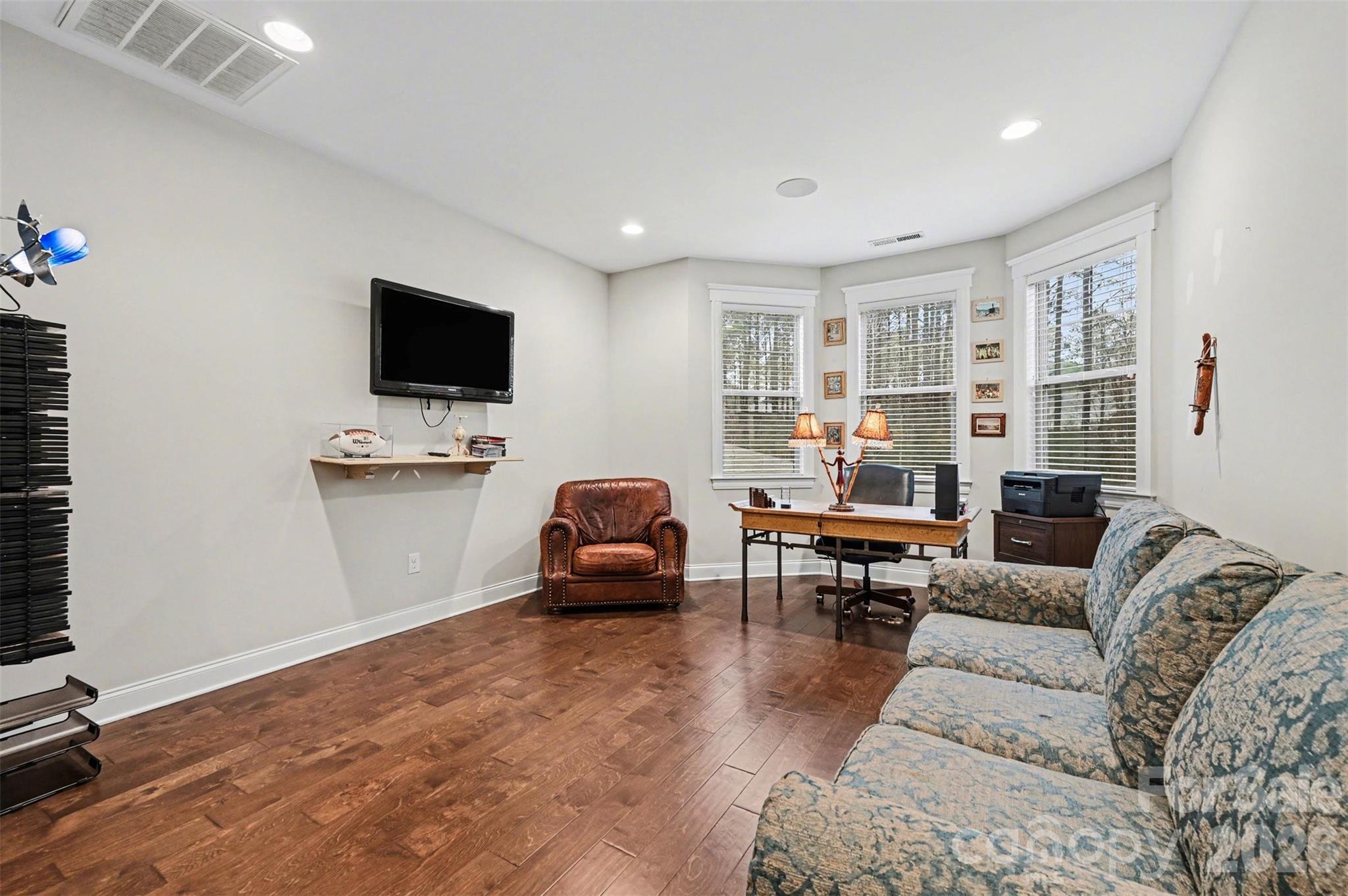 6302 Chimney Bluff Road Lancaster, SC 29720 - Photo 23 of 47 a living room with furniture and a flat screen tv