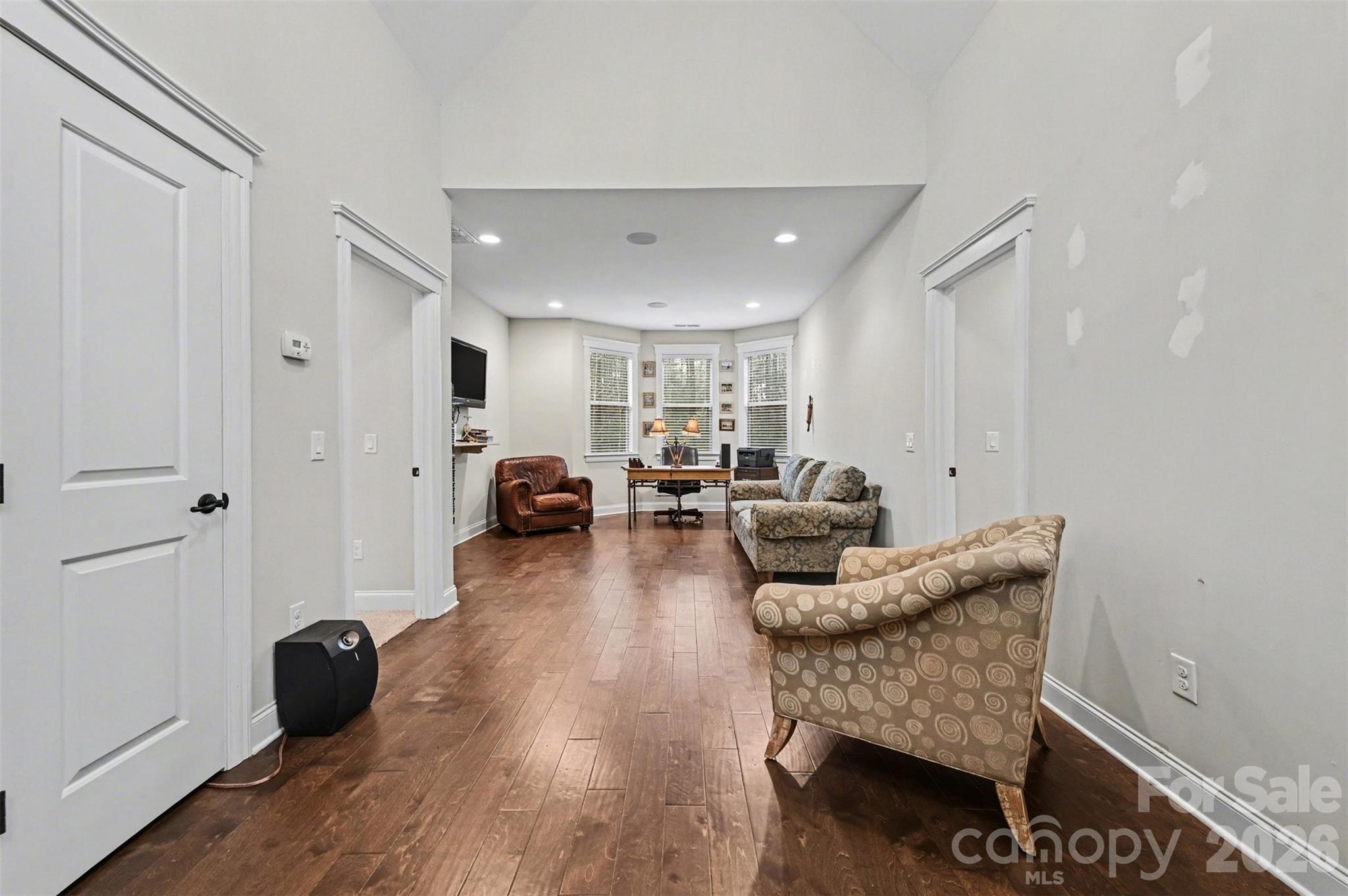 6302 Chimney Bluff Road Lancaster, SC 29720 - Photo 24 of 47 a living room with furniture and a wooden floor