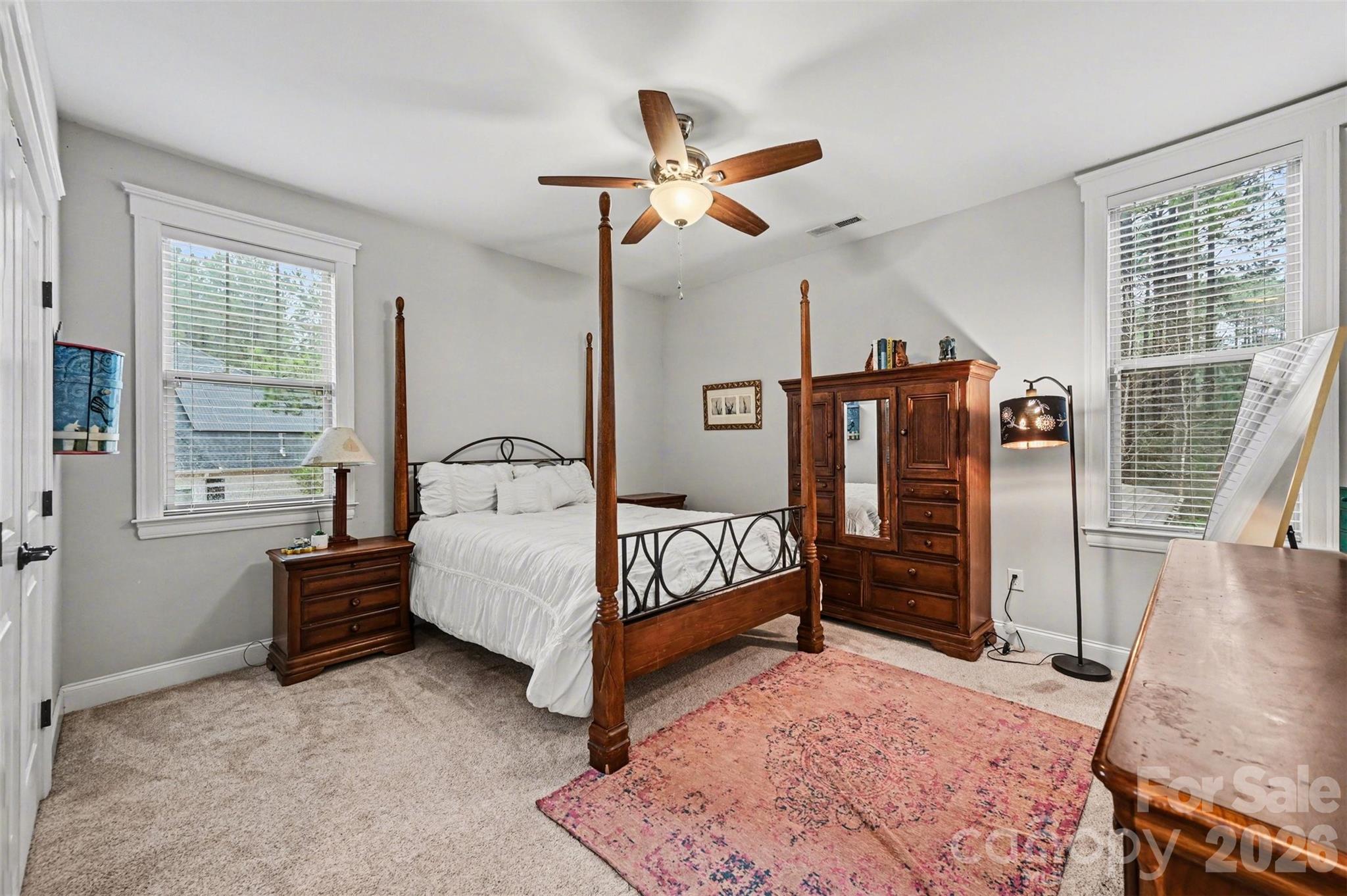 6302 Chimney Bluff Road Lancaster, SC 29720 - Photo 26 of 47 a bedroom with a bed and a chandelier