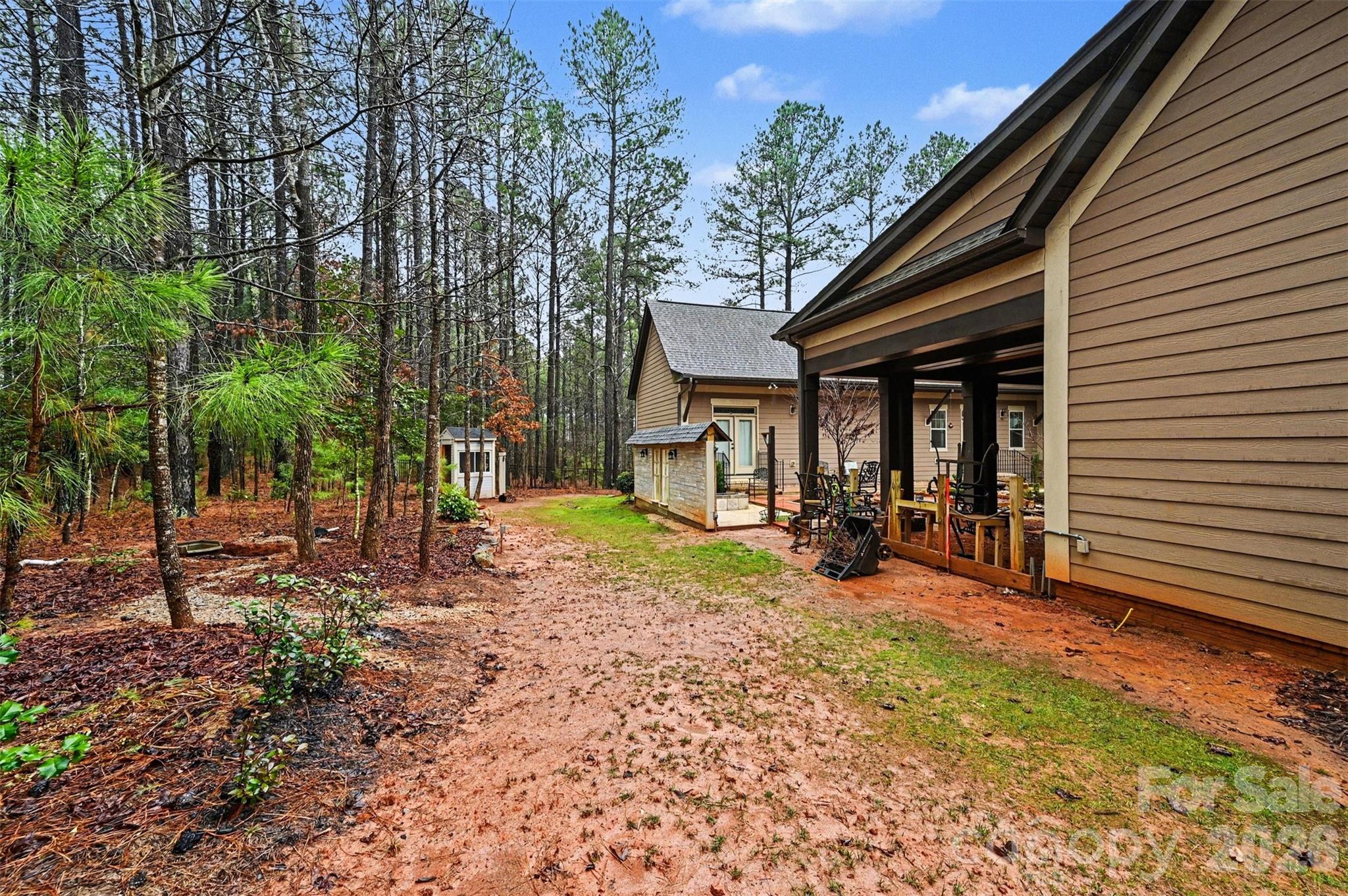 6302 Chimney Bluff Road Lancaster, SC 29720 - Photo 34 of 47 a view of a house with backyard porch and sitting area