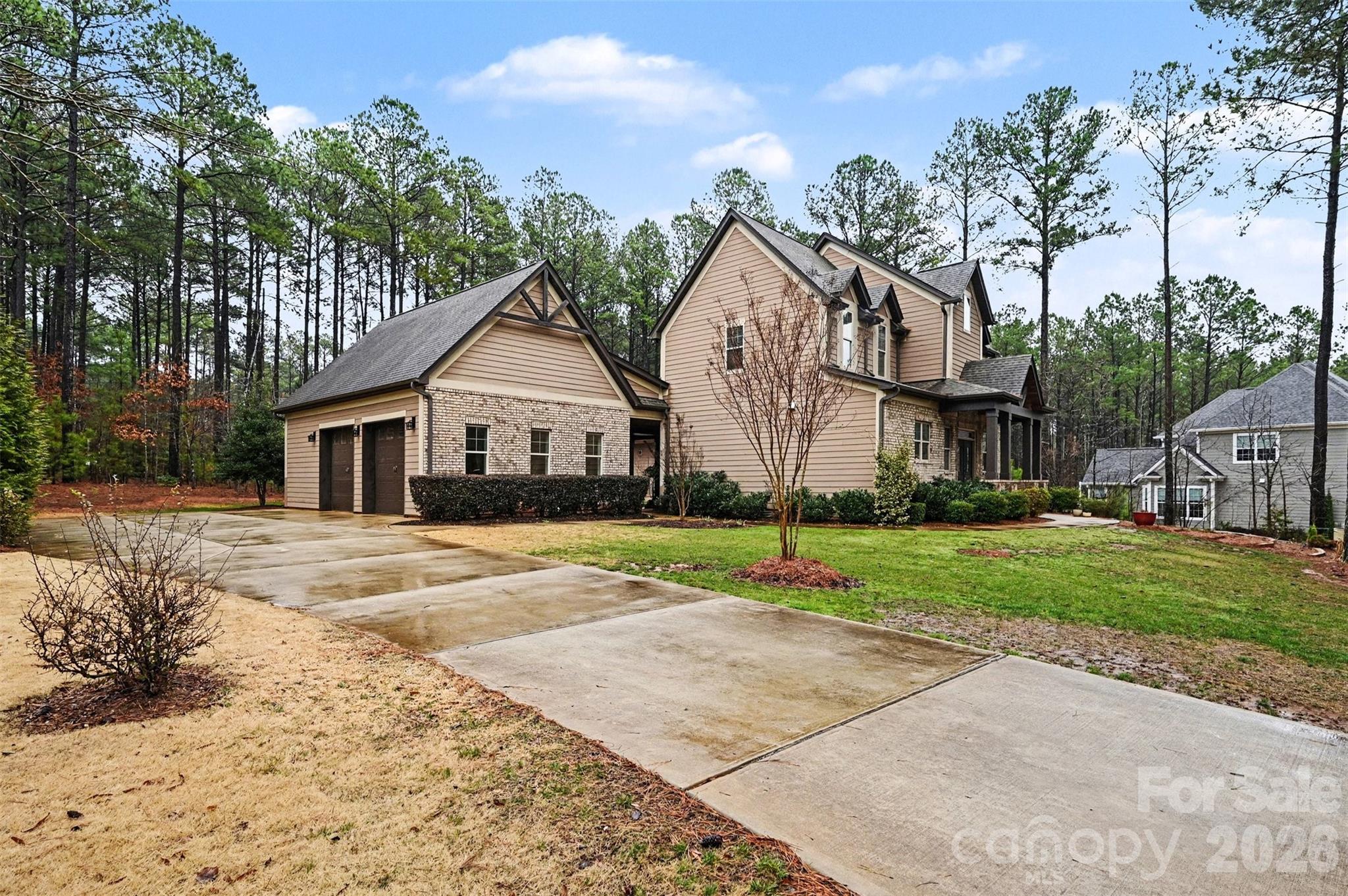 6302 Chimney Bluff Road Lancaster, SC 29720 - Photo 36 of 47 a front view of a house with a yard and garage