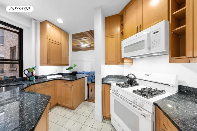 a bed room with a bed and a chair