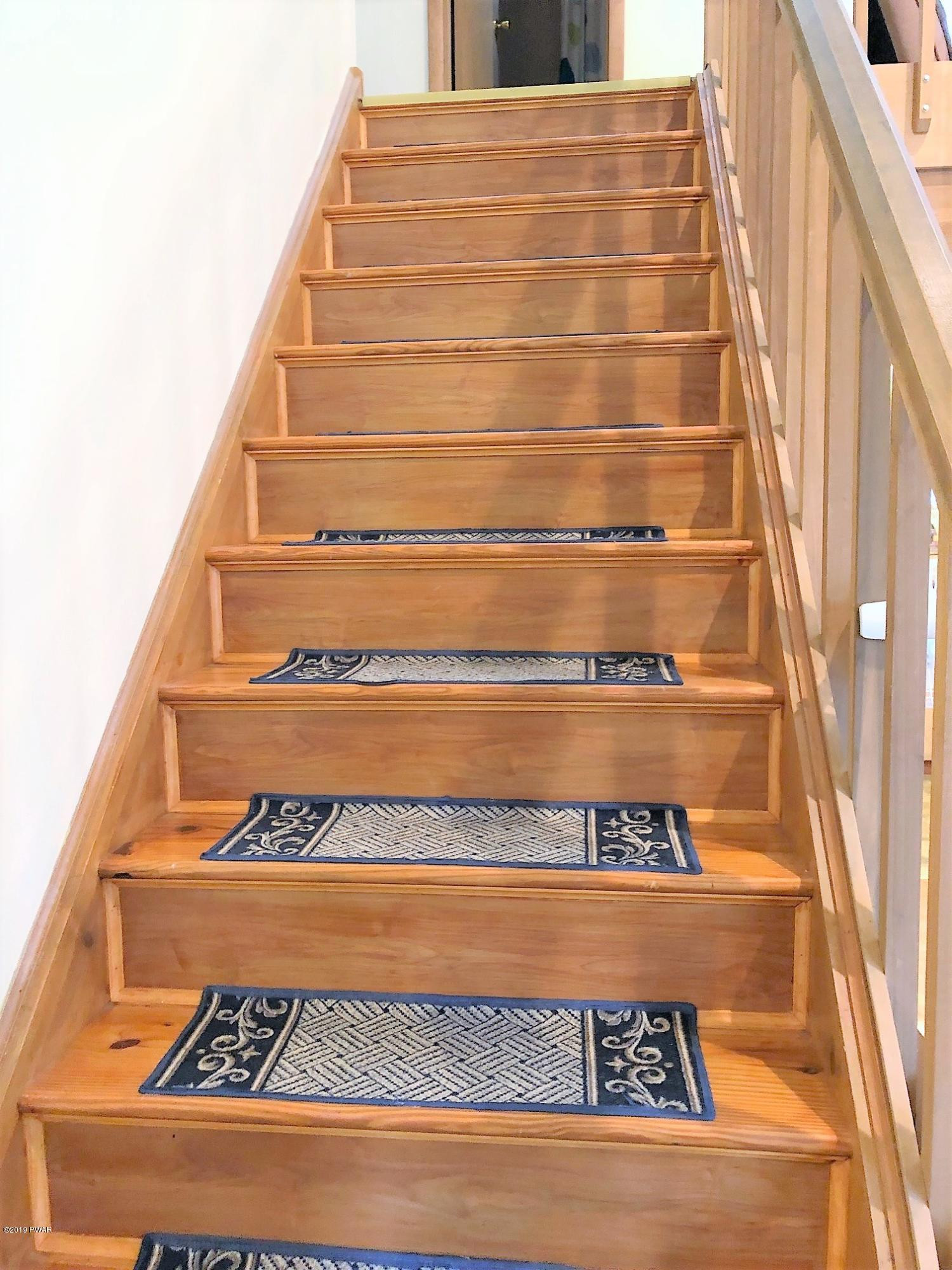 3039 Northgate Road Lake Ariel, PA 18436 - Photo 23 of 57 a view of staircase with white walls and a rug