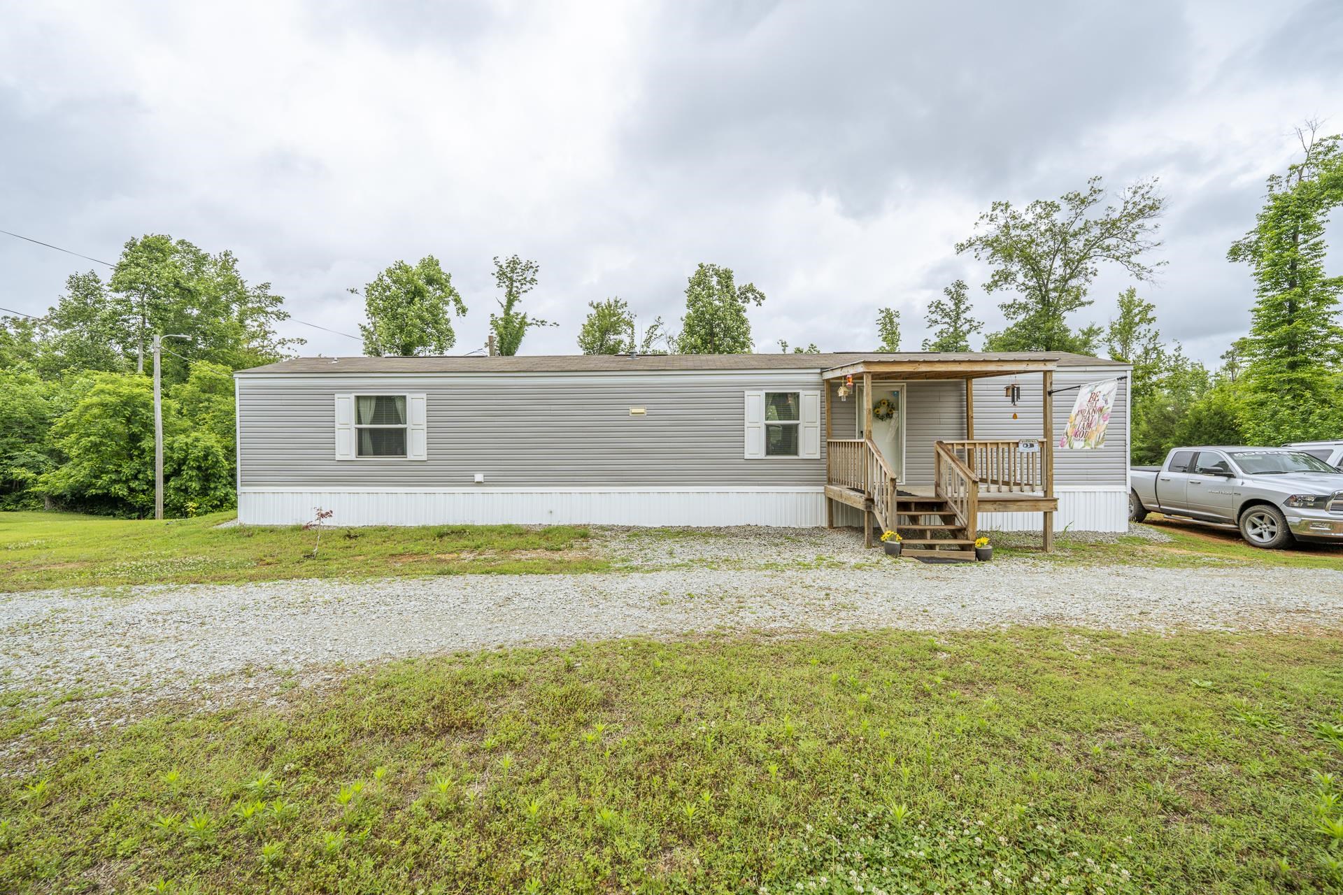 3275 Glendale Road Adamsville, TN 38310 - Photo 2 of 39 a view of a house with backyard and sitting area