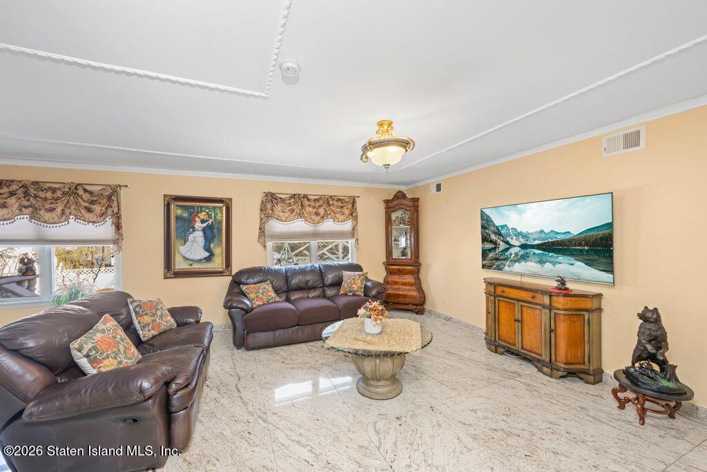 5 Rigimar Court Staten Island, NY 10309 - Photo 12 of 37 a living room with furniture and a flat screen tv