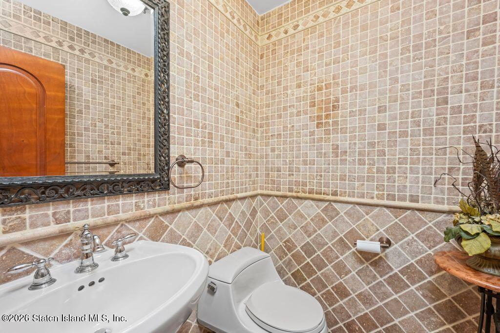 5 Rigimar Court Staten Island, NY 10309 - Photo 14 of 37 a bathroom with a sink and a mirror