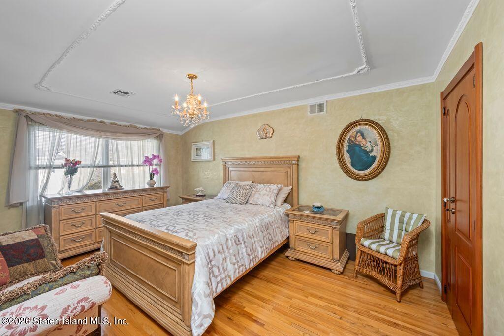 5 Rigimar Court Staten Island, NY 10309 - Photo 18 of 37 a living room with a bed furniture and a large window
