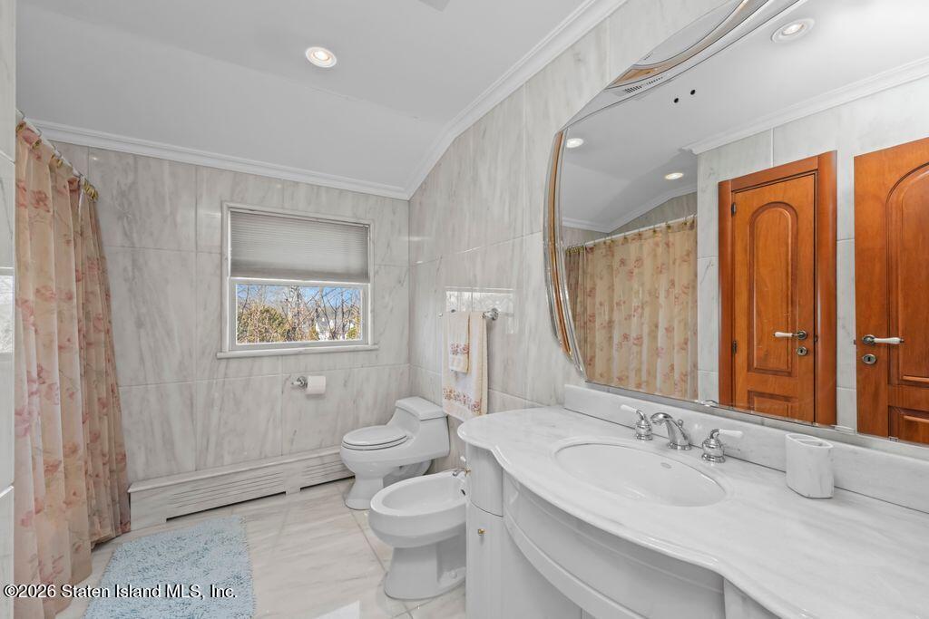 5 Rigimar Court Staten Island, NY 10309 - Photo 20 of 37 a bathroom with a granite countertop sink toilet and shower