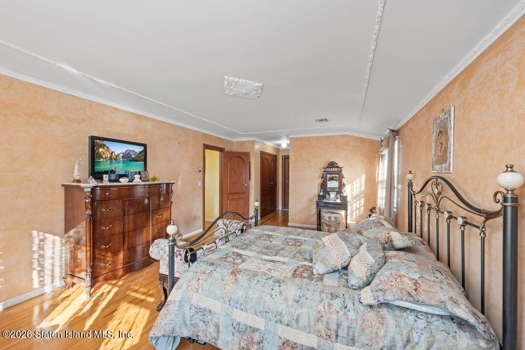5 Rigimar Court Staten Island, NY 10309 - Photo 24 of 37 a bedroom with a bed a mirror and desk