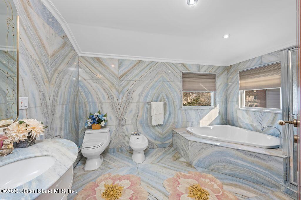 5 Rigimar Court Staten Island, NY 10309 - Photo 25 of 37 a bathroom with a granite countertop toilet and a sink