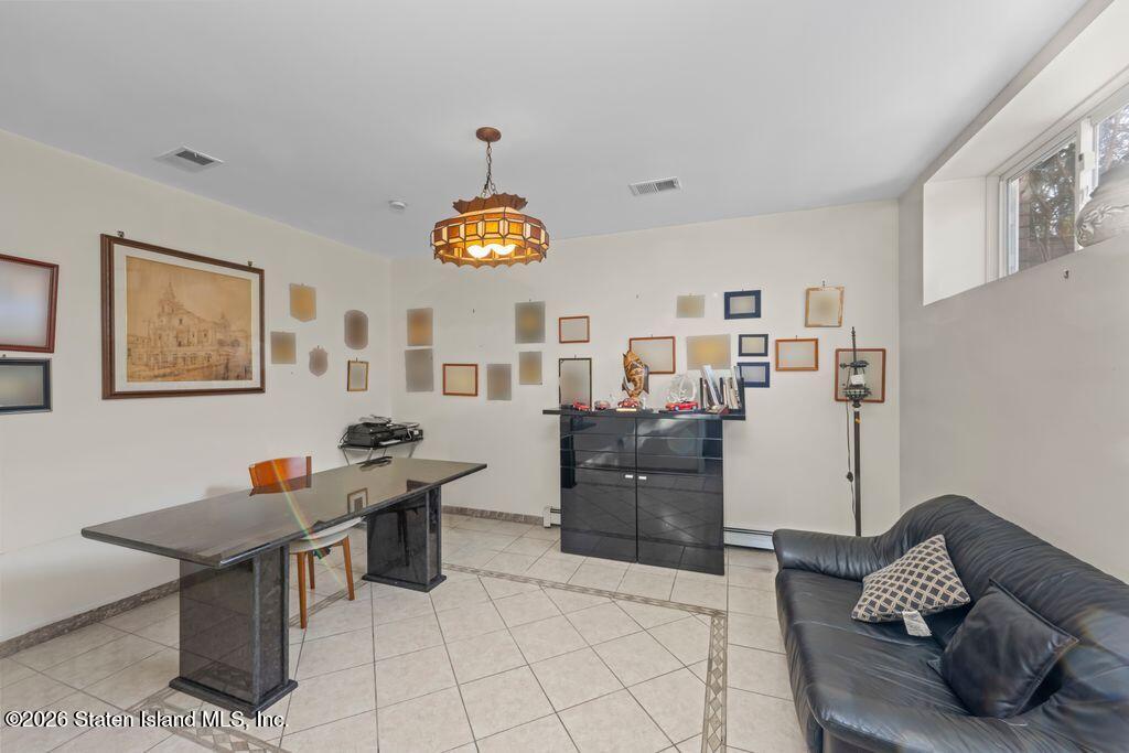 5 Rigimar Court Staten Island, NY 10309 - Photo 28 of 37 a living room with furniture and painting on the wall