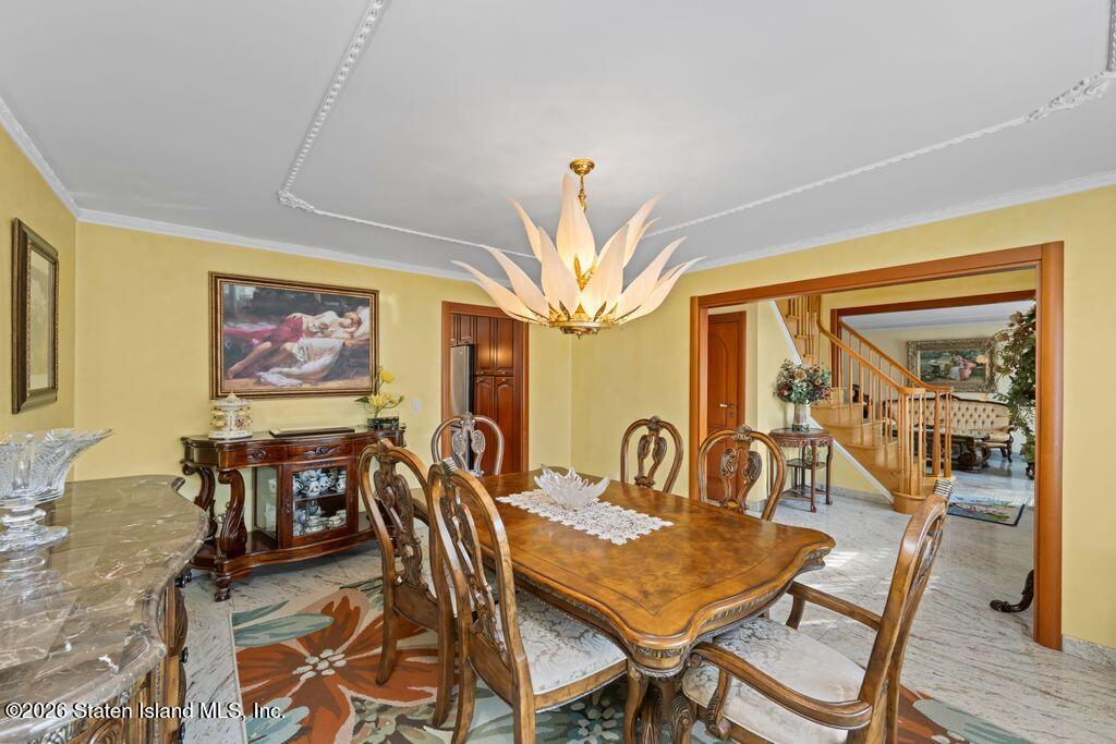 5 Rigimar Court Staten Island, NY 10309 - Photo 5 of 37 a view of a dining room with furniture wooden floor and chandelier