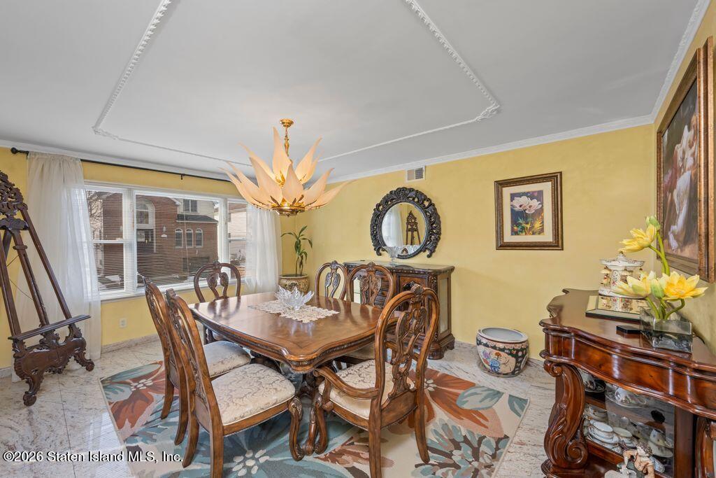 5 Rigimar Court Staten Island, NY 10309 - Photo 6 of 37 a view of a dining room with furniture window and outside view