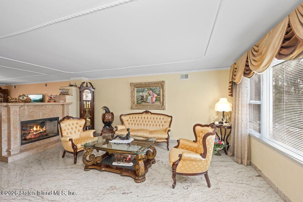 5 Rigimar Court Staten Island, NY 10309 - Photo 7 of 37 a living room with furniture and fireplace