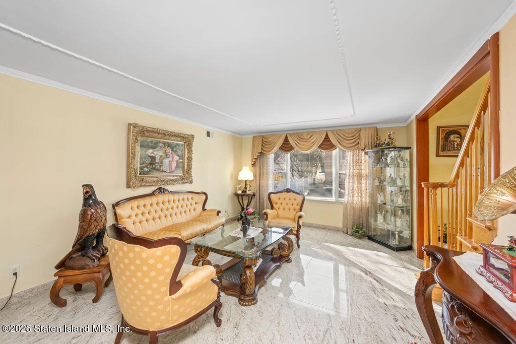 5 Rigimar Court Staten Island, NY 10309 - Photo 8 of 37 a living room with furniture and a floor to ceiling window