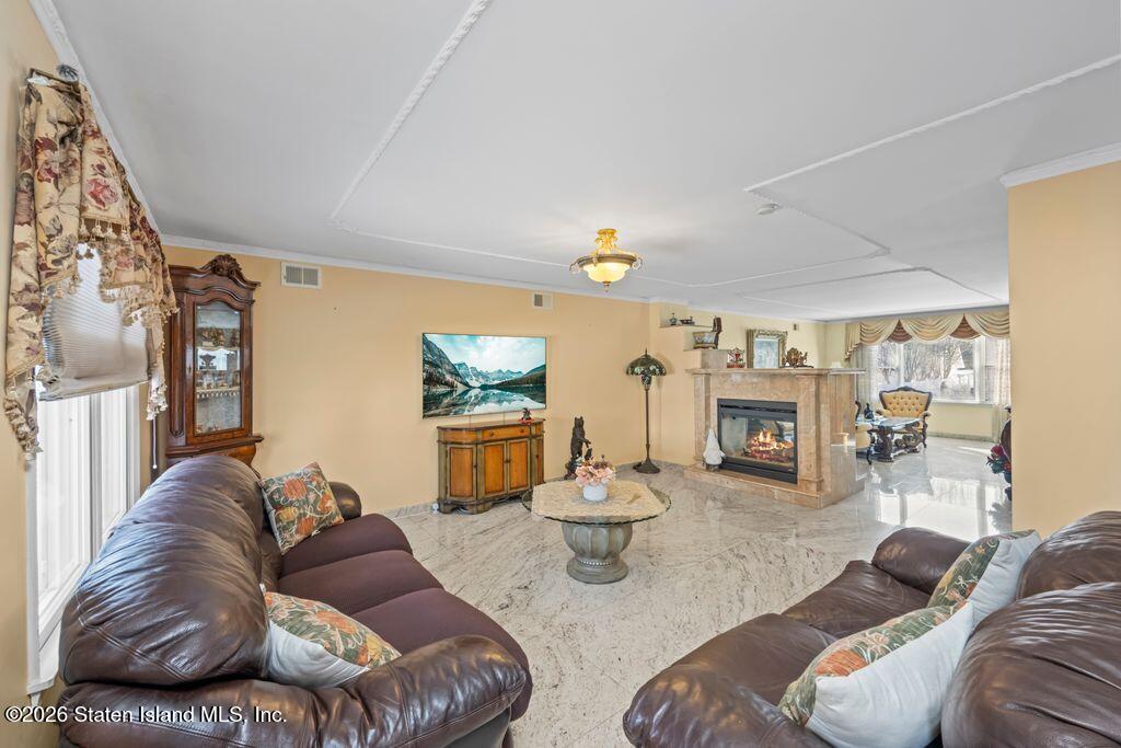 5 Rigimar Court Staten Island, NY 10309 - Photo 9 of 37 a living room with furniture and a fireplace