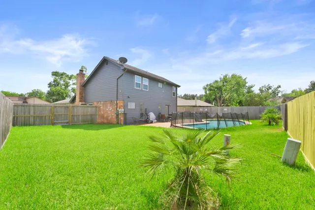 a backyard of a house with lots of green space