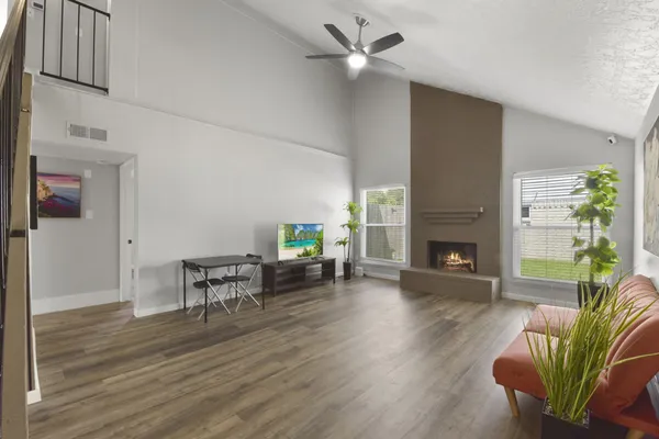 a living room with furniture and a fireplace