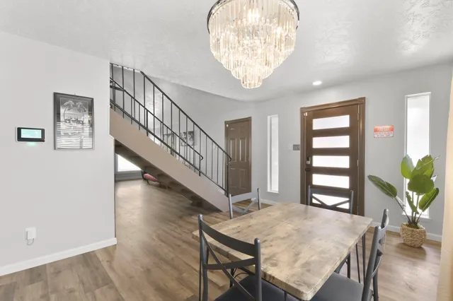 a view of a livingroom with furniture and hardwood floor