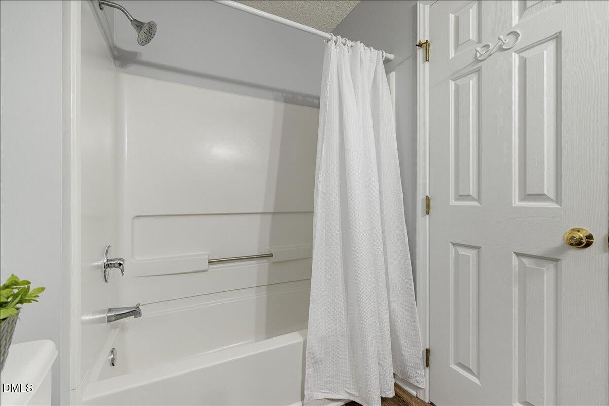 12436 Harcourt Drive Raleigh, NC 27613 - Photo 18 of 29 a bathroom with a shower