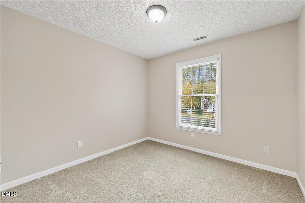 12436 Harcourt Drive Raleigh, NC 27613 - Photo 20 of 29 an empty room with a window