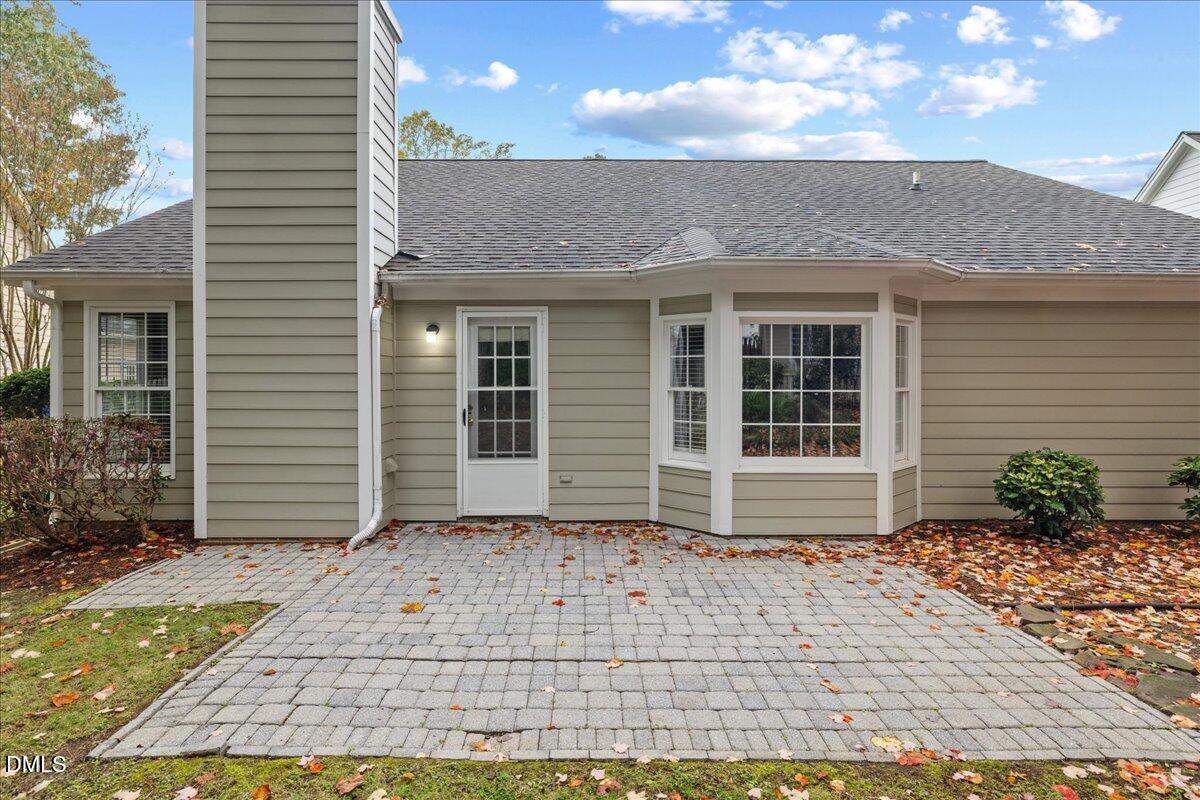12436 Harcourt Drive Raleigh, NC 27613 - Photo 22 of 29 a view of a house with a garden