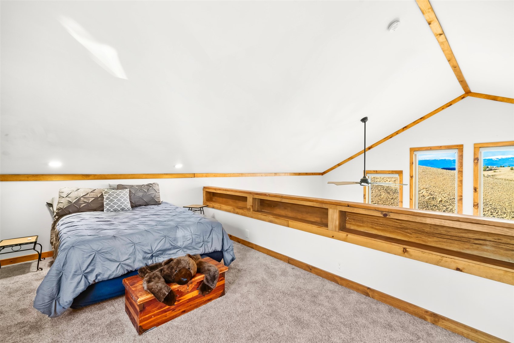 440 Arland Road Como, CO 80432 - Photo 20 of 49 a bedroom with a bed and a large window
