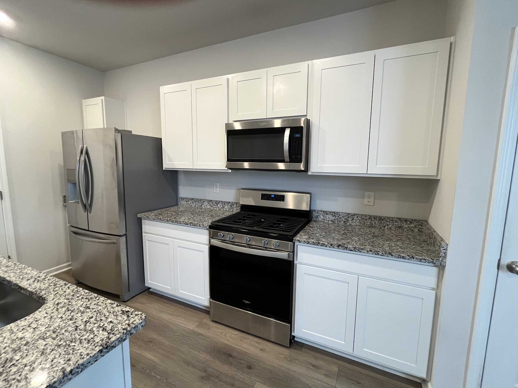 441 Waterfowl Way Lebanon, TN 37090 - Photo 6 of 21 a kitchen with a stove microwave and refrigerator