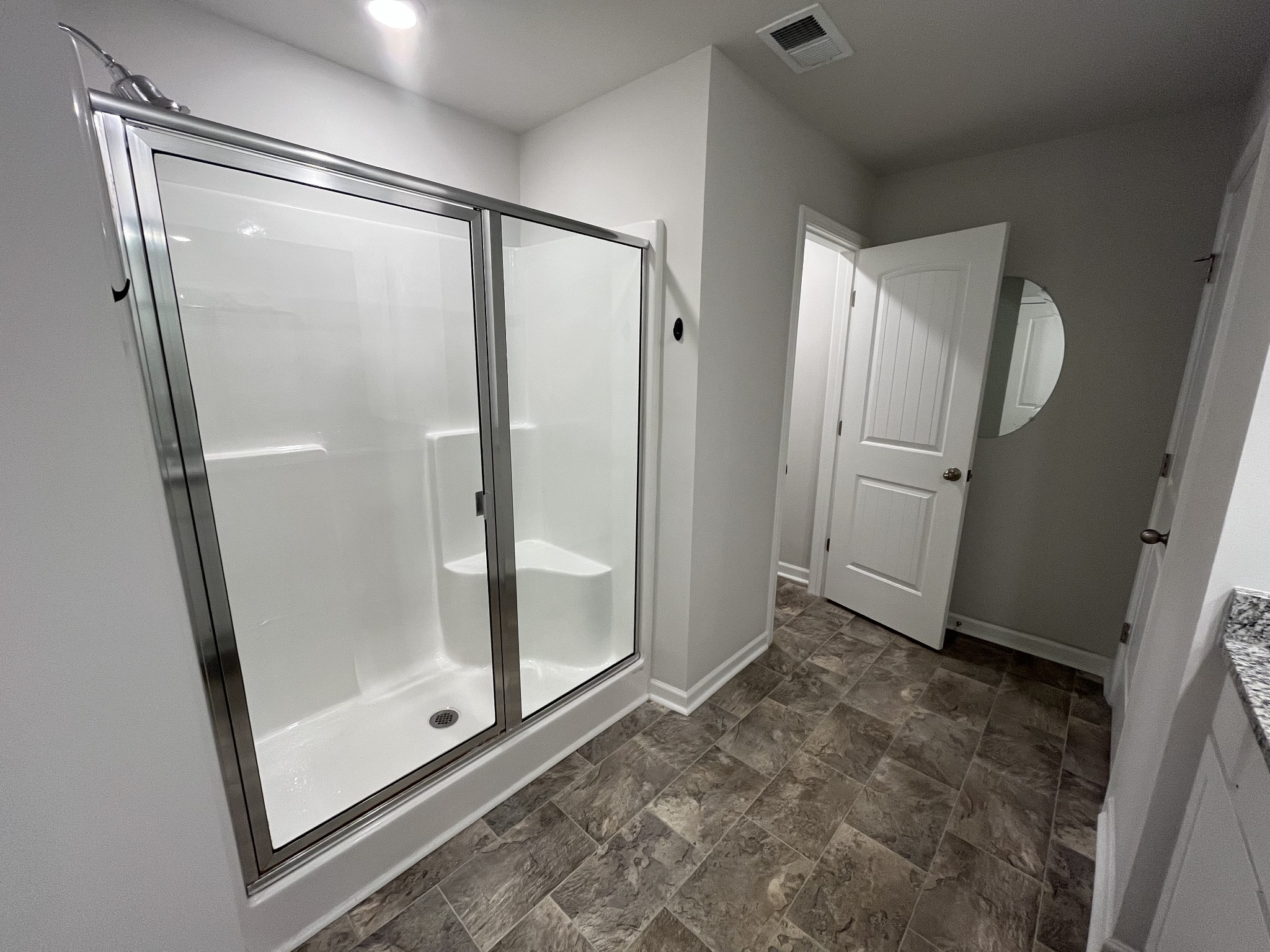 441 Waterfowl Way Lebanon, TN 37090 - Photo 10 of 21 a bathroom with a glass shower door