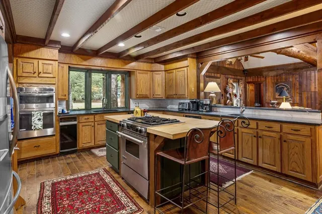 a kitchen with a stove and a sink