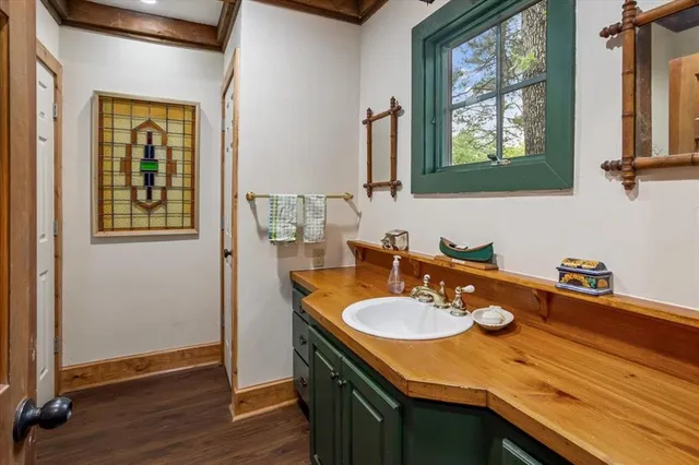 a bathroom with a sink double vanity and a mirror