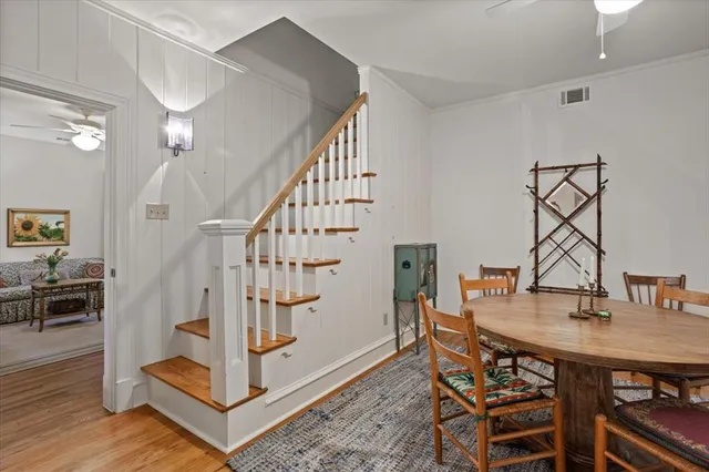 a view of entryway dining room and hall with wooden floor