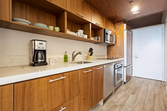 a kitchen with a stove and a sink