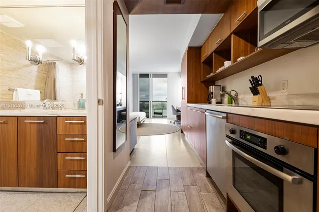 a bathroom with a granite countertop toilet a sink and bathtub
