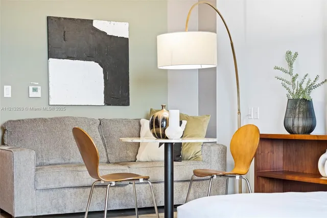 a view of kitchen with furniture and a potted plant
