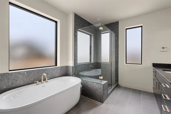 a bathroom with a bathtub and a sink
