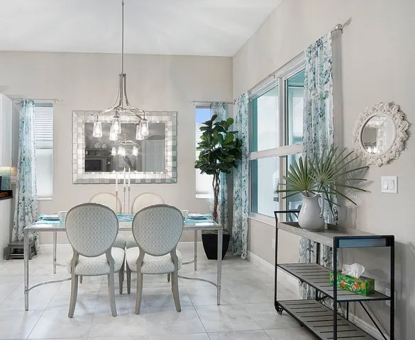 a view of a livingroom with furniture window and wooden floor