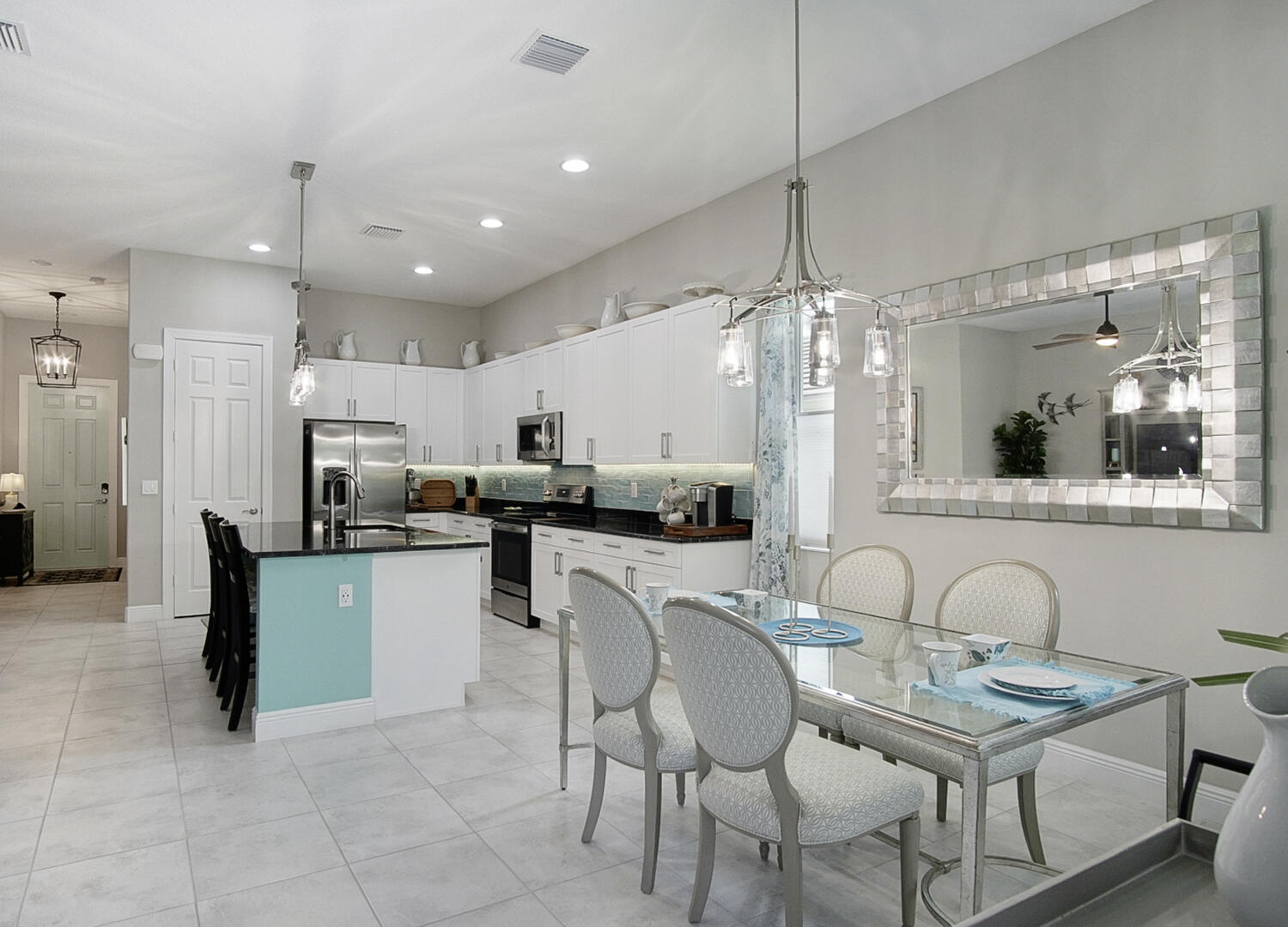 2652 Conifer Drive Fort Pierce, FL 34951 - Photo 15 of 45 a kitchen with sink cabinets and dining table