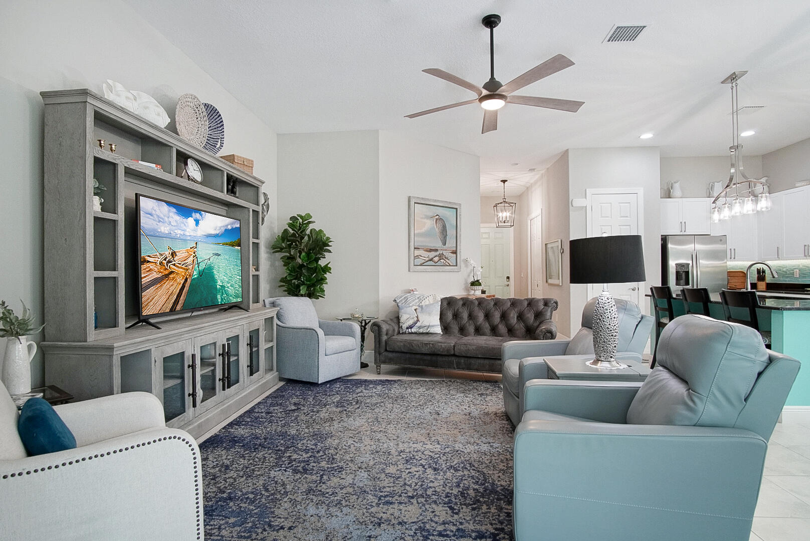 2652 Conifer Drive Fort Pierce, FL 34951 - Photo 16 of 45 a living room with furniture and a flat screen tv