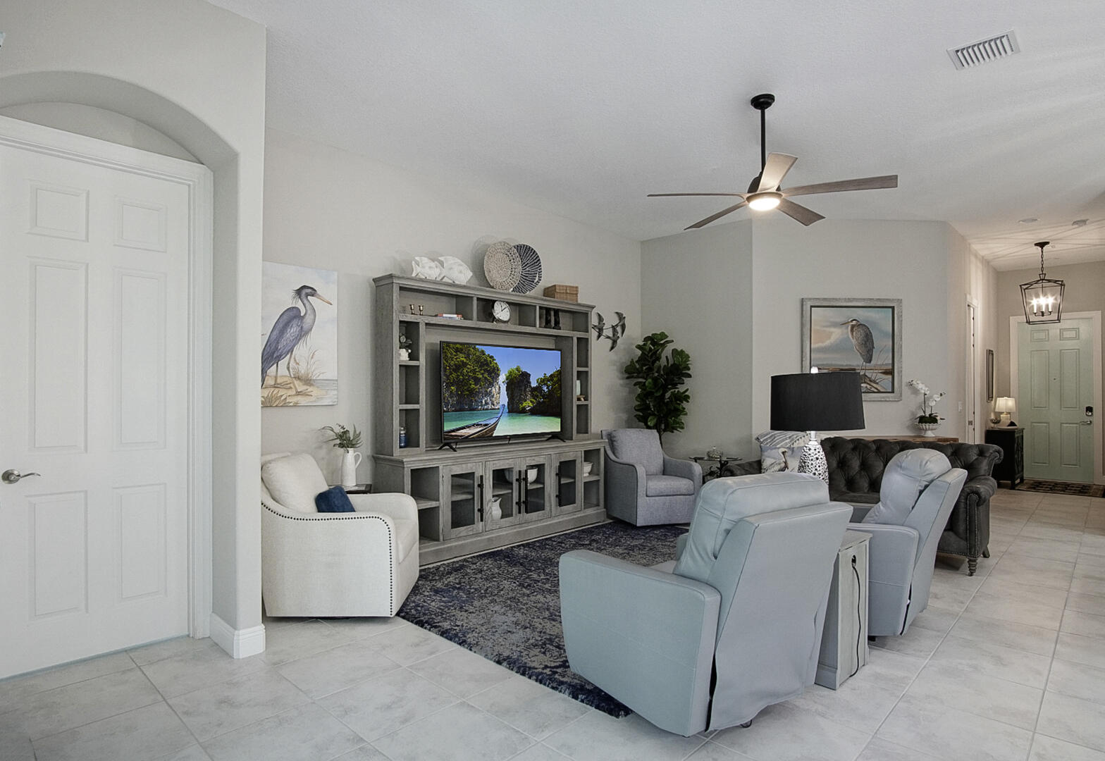 2652 Conifer Drive Fort Pierce, FL 34951 - Photo 18 of 45 a living room with furniture and a flat screen tv