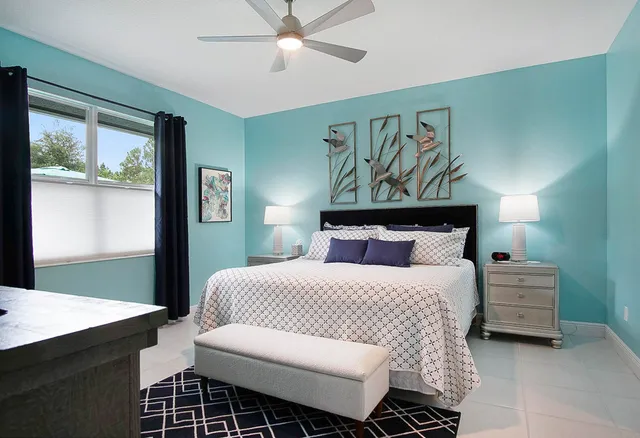 a bedroom with a bed and a table