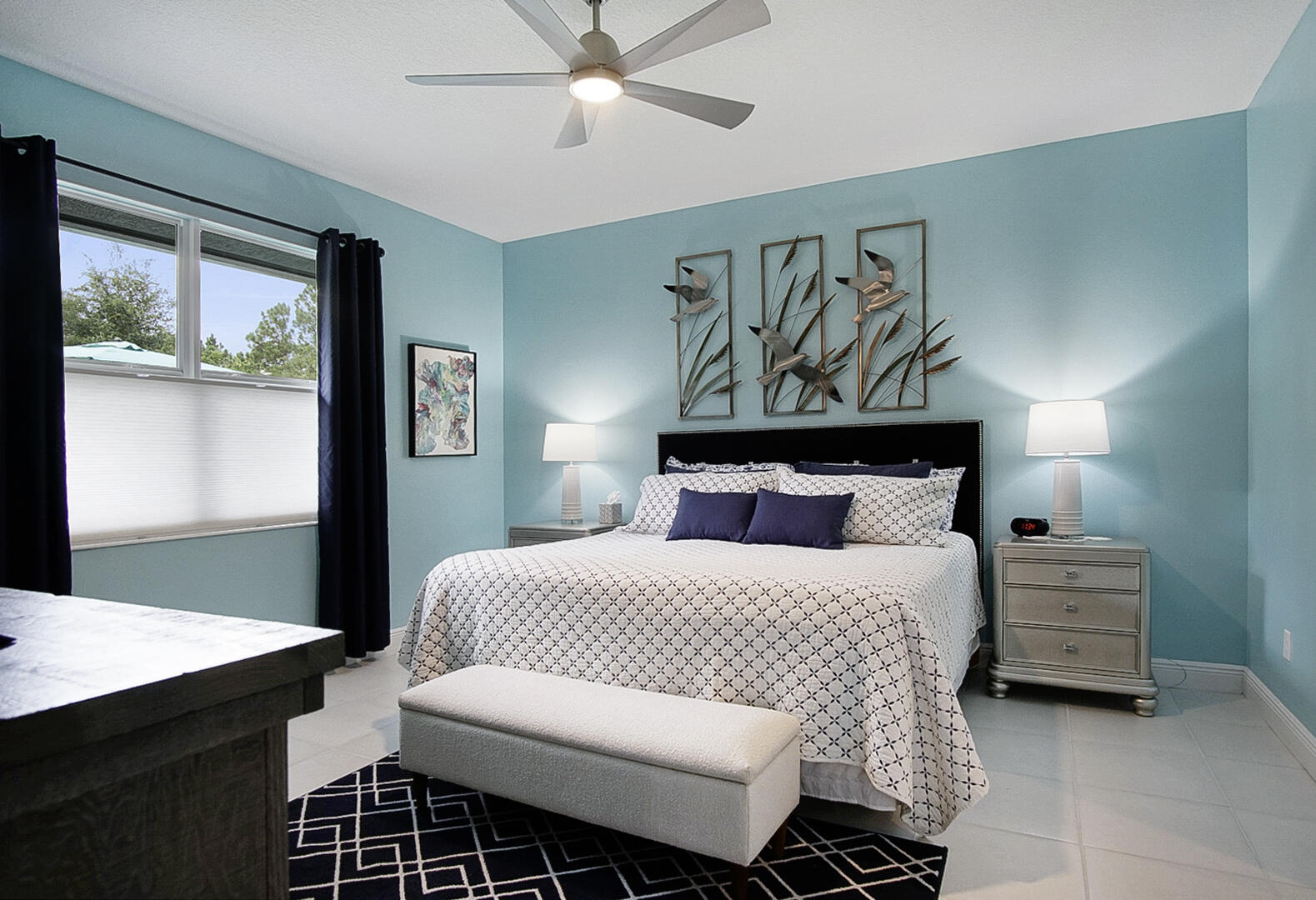 2652 Conifer Drive Fort Pierce, FL 34951 - Photo 20 of 45 a bedroom with a bed and a table