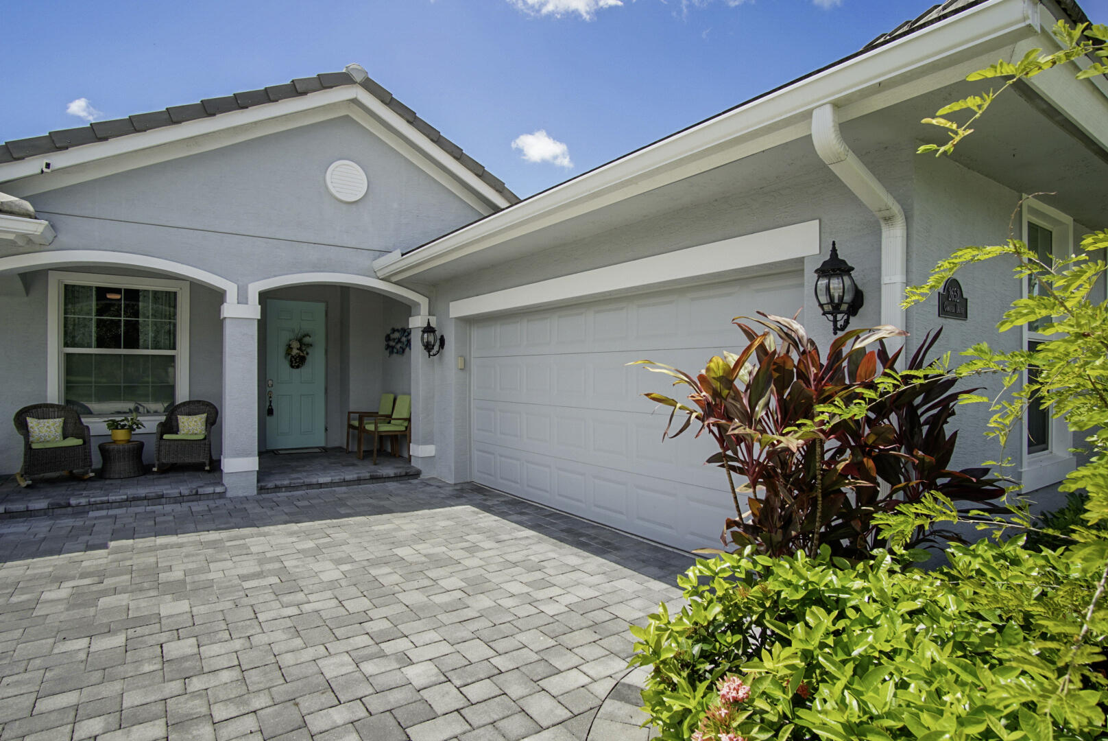 2652 Conifer Drive Fort Pierce, FL 34951 - Photo 2 of 45 a view of a house with a flower garden