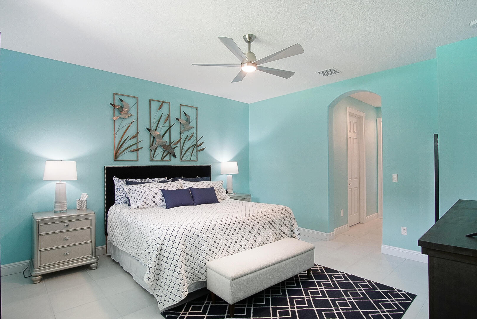 2652 Conifer Drive Fort Pierce, FL 34951 - Photo 21 of 45 a bedroom with a bed and a chandelier