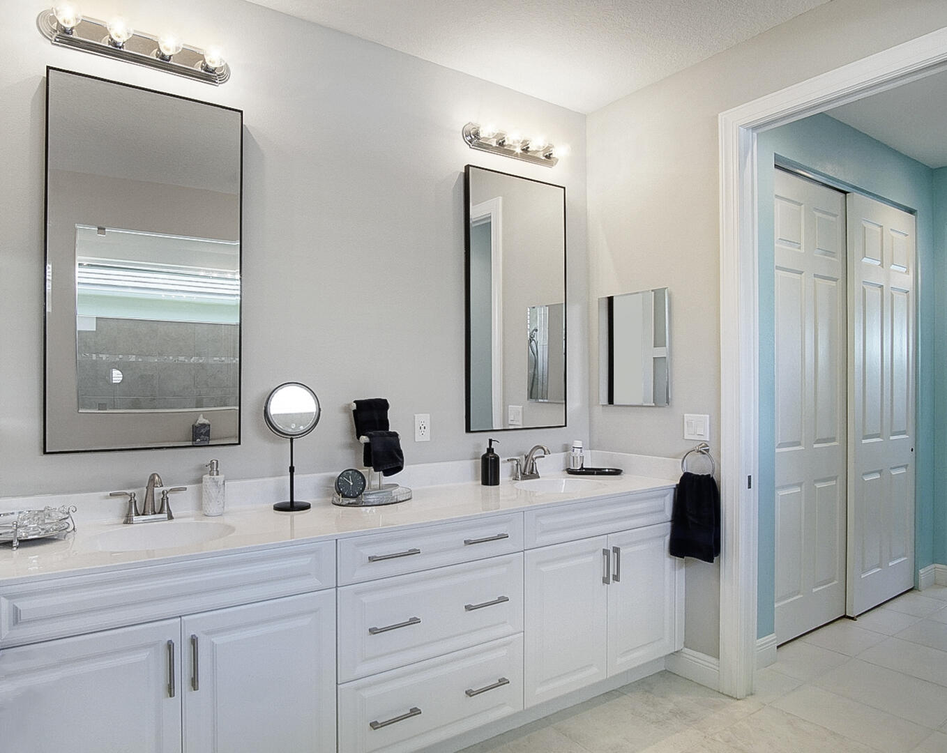 2652 Conifer Drive Fort Pierce, FL 34951 - Photo 24 of 45 a bathroom with double vanity sinks and a mirror