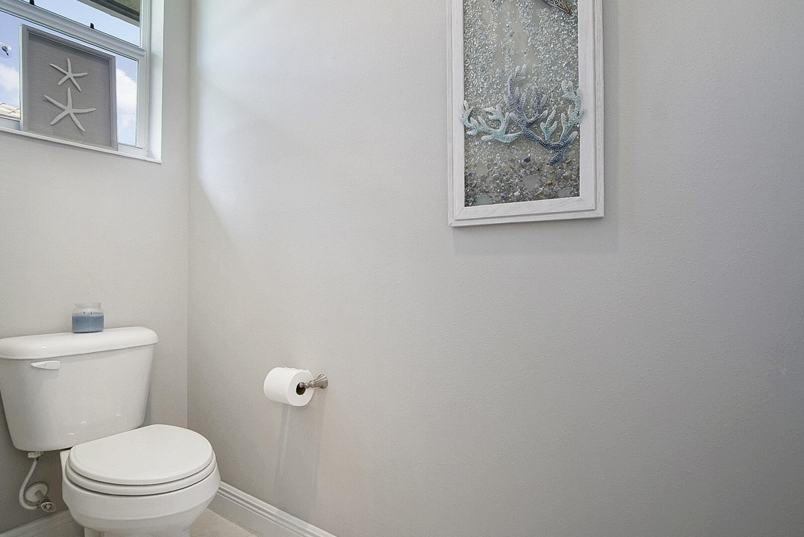 2652 Conifer Drive Fort Pierce, FL 34951 - Photo 27 of 45 a white toilet sitting next to a small bathroom